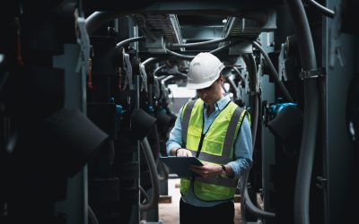 Engineers are inspecting a large building or industrial facility's cooling system for the air conditioning.